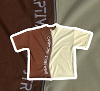 a brown and white t - shirt with a zipper on it